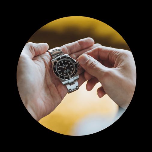 manually winding up a rolex submariner