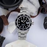 Rolex Submariner Date 16610 (1997) - Zwart wijzerplaat 40mm Staal (1/8)