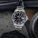 Rolex Submariner Date 16610 (1997) - Zwart wijzerplaat 40mm Staal (1/8)