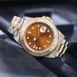 Rolex GMT-Master II 16713 (1992) - Bruin wijzerplaat 40mm Goud/Staal (1/8)