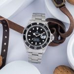 Rolex Submariner Date 16610 (1997) - Zwart wijzerplaat 40mm Staal (1/8)