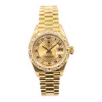 Rolex Lady-Datejust 69258 (1990) - Champagne wijzerplaat 26mm Geelgoud (1/4)