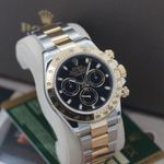 Rolex Daytona 116523 (2015) - Zwart wijzerplaat 40mm Goud/Staal (1/8)