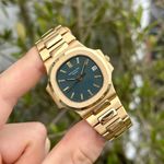 Patek Philippe Nautilus 3800 (1994) - Yellow dial 38 mm Yellow Gold case (1/3)