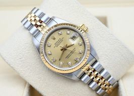 Rolex Lady-Datejust 69173 (1987) - Champagne wijzerplaat 26mm Goud/Staal