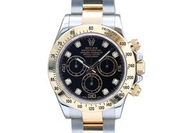 Rolex Daytona 116523 (Unknown (random serial)) - Black dial 40 mm Gold/Steel case