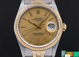 Rolex Oyster Perpetual Date 15223 (1990) - Champagne wijzerplaat 34mm Goud/Staal