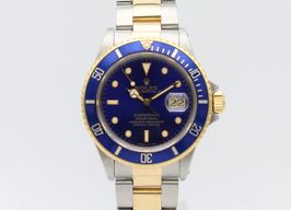 Rolex Submariner Date 16803 (1987) - Blauw wijzerplaat 40mm Goud/Staal