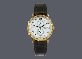 Patek Philippe Travel Time 5034J (1999) - White dial 34 mm Yellow Gold case
