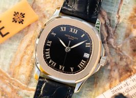 Patek Philippe Aquanaut 5060J (1997) - Black dial 36 mm Yellow Gold case