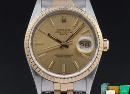 Rolex Oyster Perpetual Date 15223 (1990) - Champagne dial 34 mm Gold/Steel case