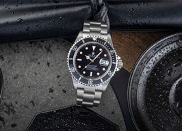 Rolex Submariner Date 16610 (1997) - Zwart wijzerplaat 40mm Staal