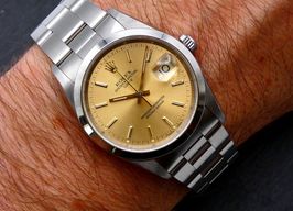 Rolex Oyster Perpetual Date 15200 (1990) - Gold dial 34 mm Steel case