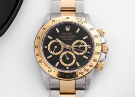 Rolex Daytona 16523 (1999) - Black dial 40 mm Gold/Steel case