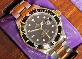 Rolex Submariner Date 16613 (2010) - Black dial 40 mm Gold/Steel case