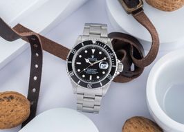 Rolex Submariner Date 16610 (1997) - Zwart wijzerplaat 40mm Staal