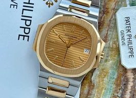 Patek Philippe Nautilus 3800 (1994) - Gold dial 37 mm Gold/Steel case