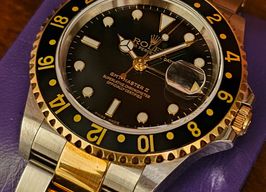 Rolex GMT-Master II 16713 (2001) - Black dial 40 mm Gold/Steel case