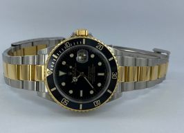 Rolex Submariner Date - (Unknown (random serial)) - Black dial 40 mm Gold/Steel case