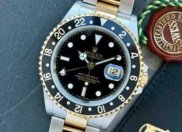 Rolex GMT-Master II 16713 (1999) - Black dial 40 mm Gold/Steel case