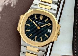 Patek Philippe Nautilus 3800 (Onbekend (willekeurig serienummer)) - Blauw wijzerplaat 37mm Goud/Staal