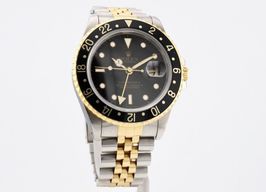 Rolex GMT-Master II 16713 (1996) - Black dial 40 mm Gold/Steel case