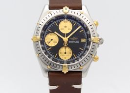 Breitling Chronomat B13047 (1990) - Black dial 39 mm Gold/Steel case