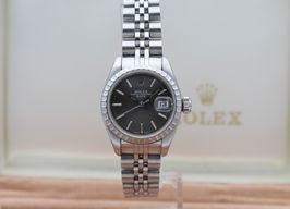 Rolex Oyster Perpetual Lady Date 69240 (1990) - Grijs wijzerplaat 26mm Staal