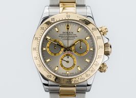 Rolex Daytona 116523 (Unknown (random serial)) - Champagne dial 40 mm Gold/Steel case